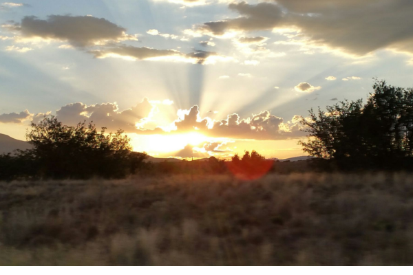 Sunset over granite boulders on 24-acre Dewey AZ ranch land